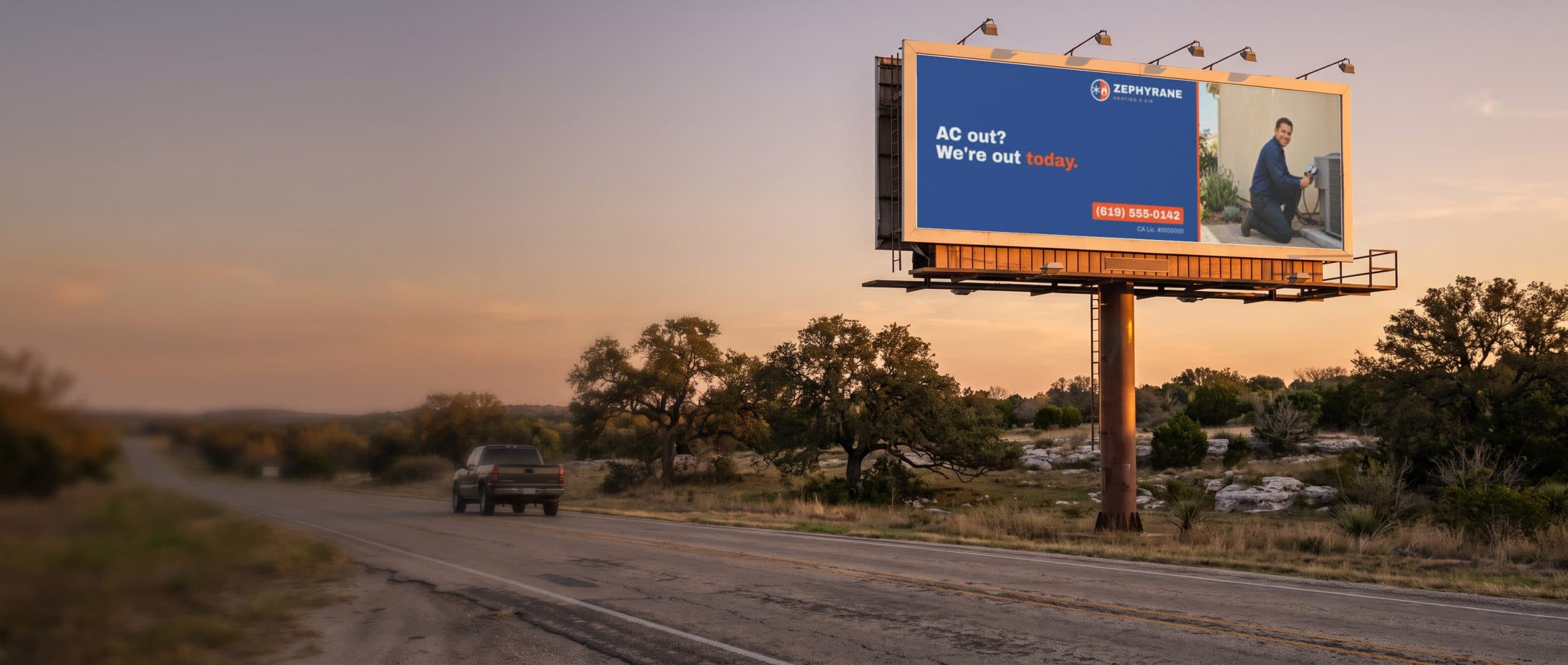 A highway billboard over Texas ranch land at golden hour, showing a heating and air company ad.