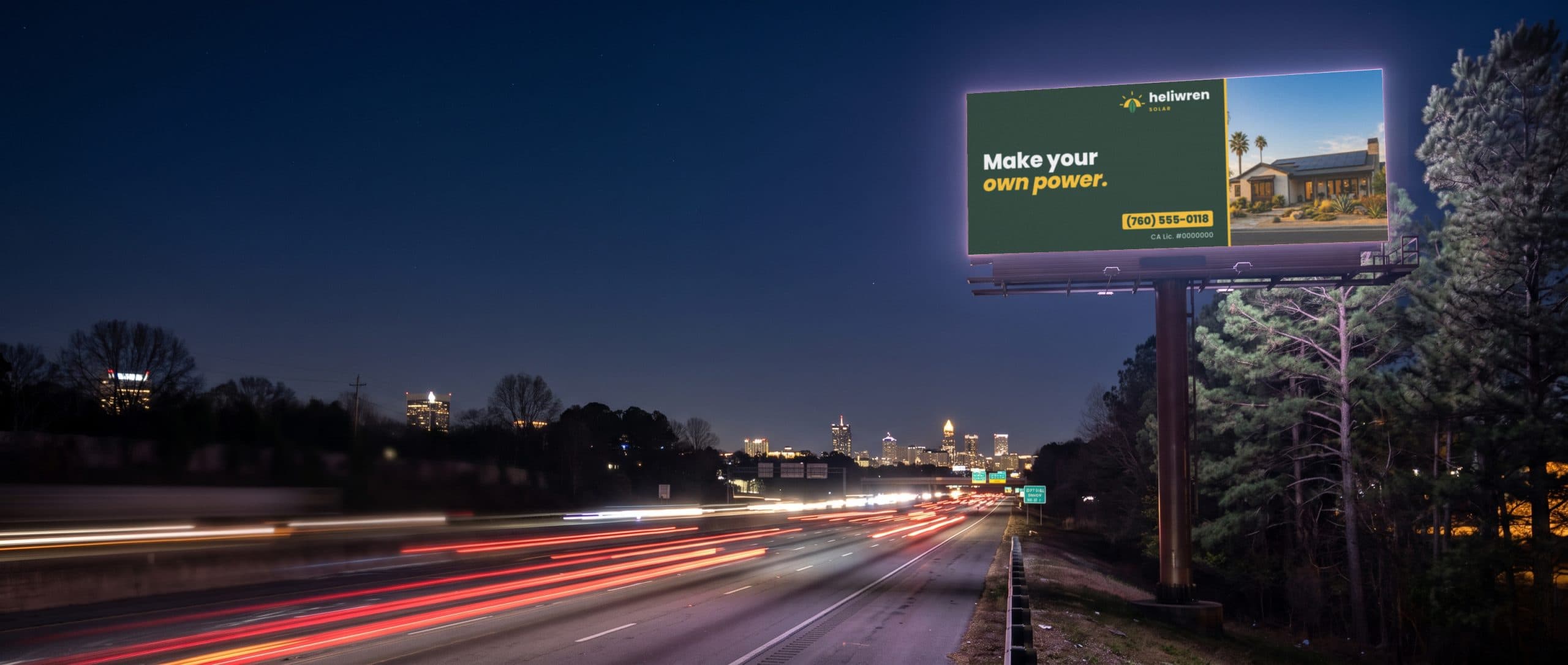 A digital billboard glowing over a freeway at night, showing a solar installer ad.