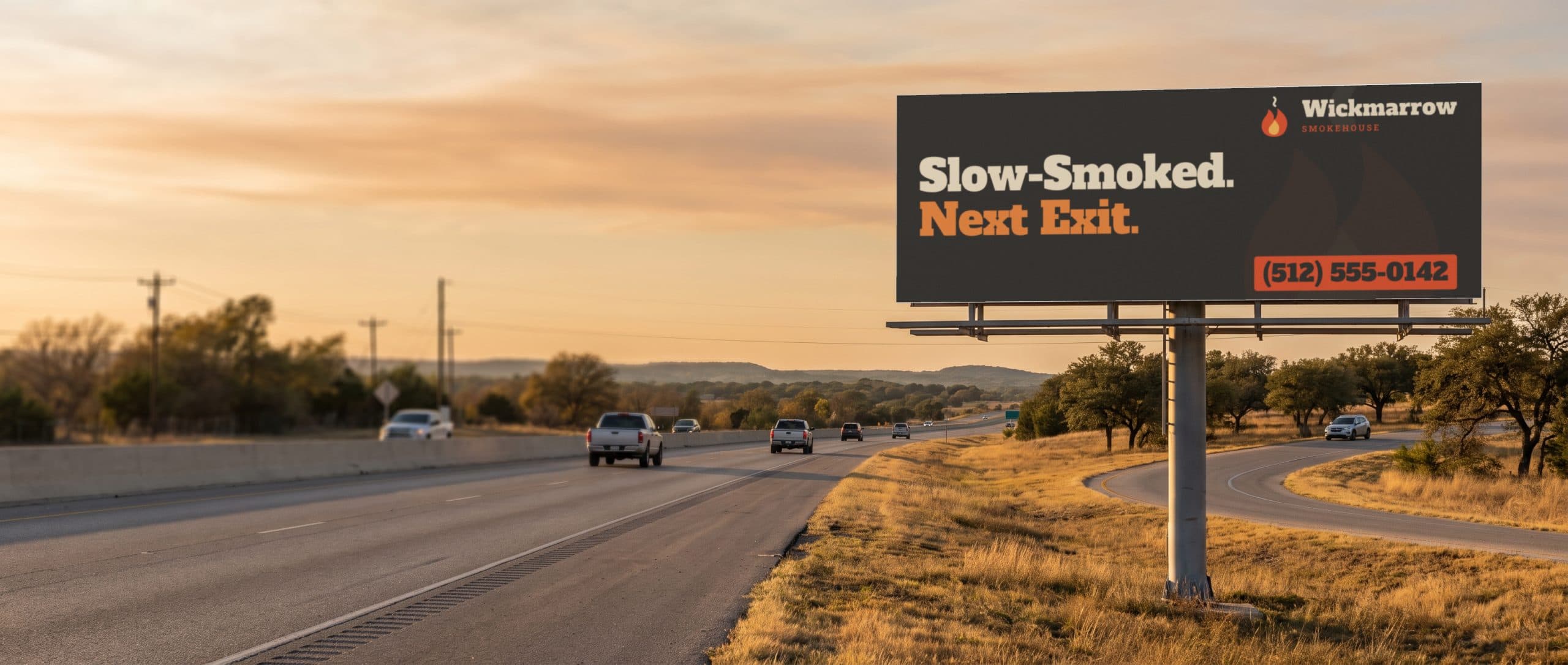 A highway billboard near an exit in Texas Hill Country, showing a barbecue restaurant ad.